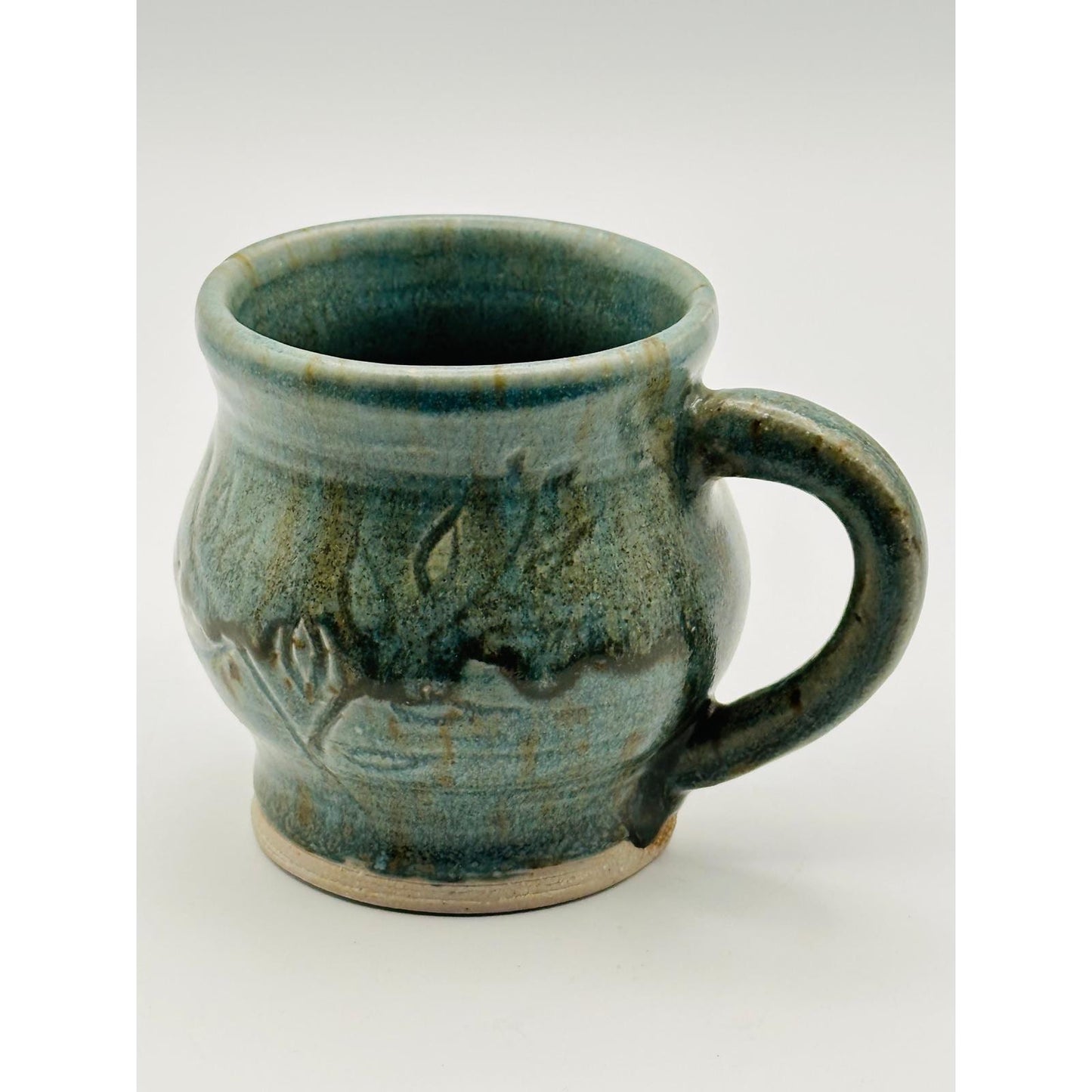 Handmade Artisan Pottery Mug – Blue Green Glaze with Raised Decorative Pattern