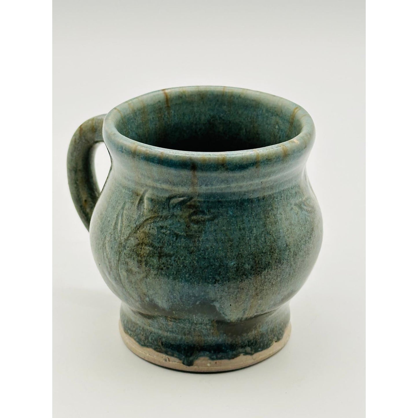 Handmade Artisan Pottery Mug – Blue Green Glaze with Raised Decorative Pattern