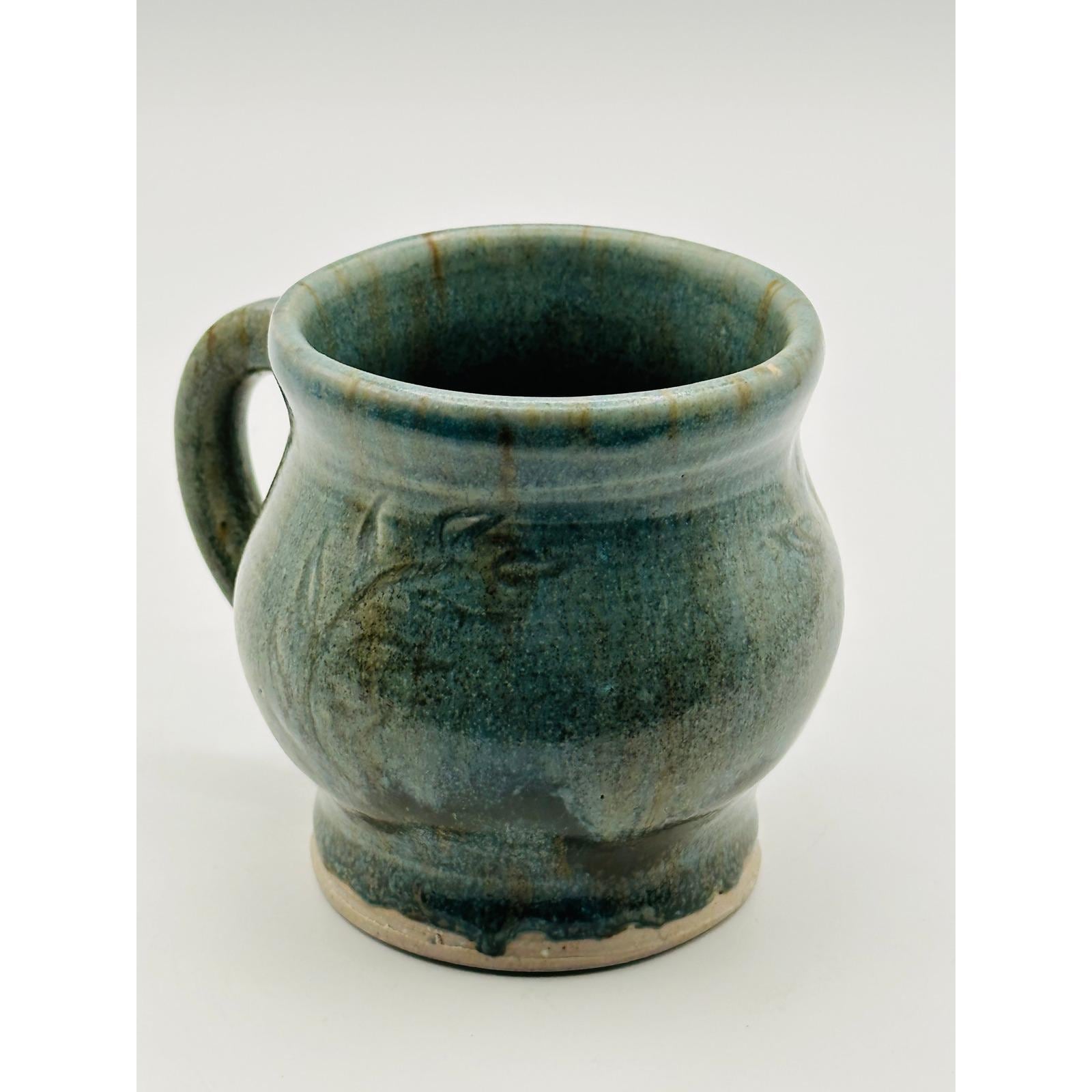 Handmade Artisan Pottery Mug – Blue Green Glaze with Raised Decorative Pattern