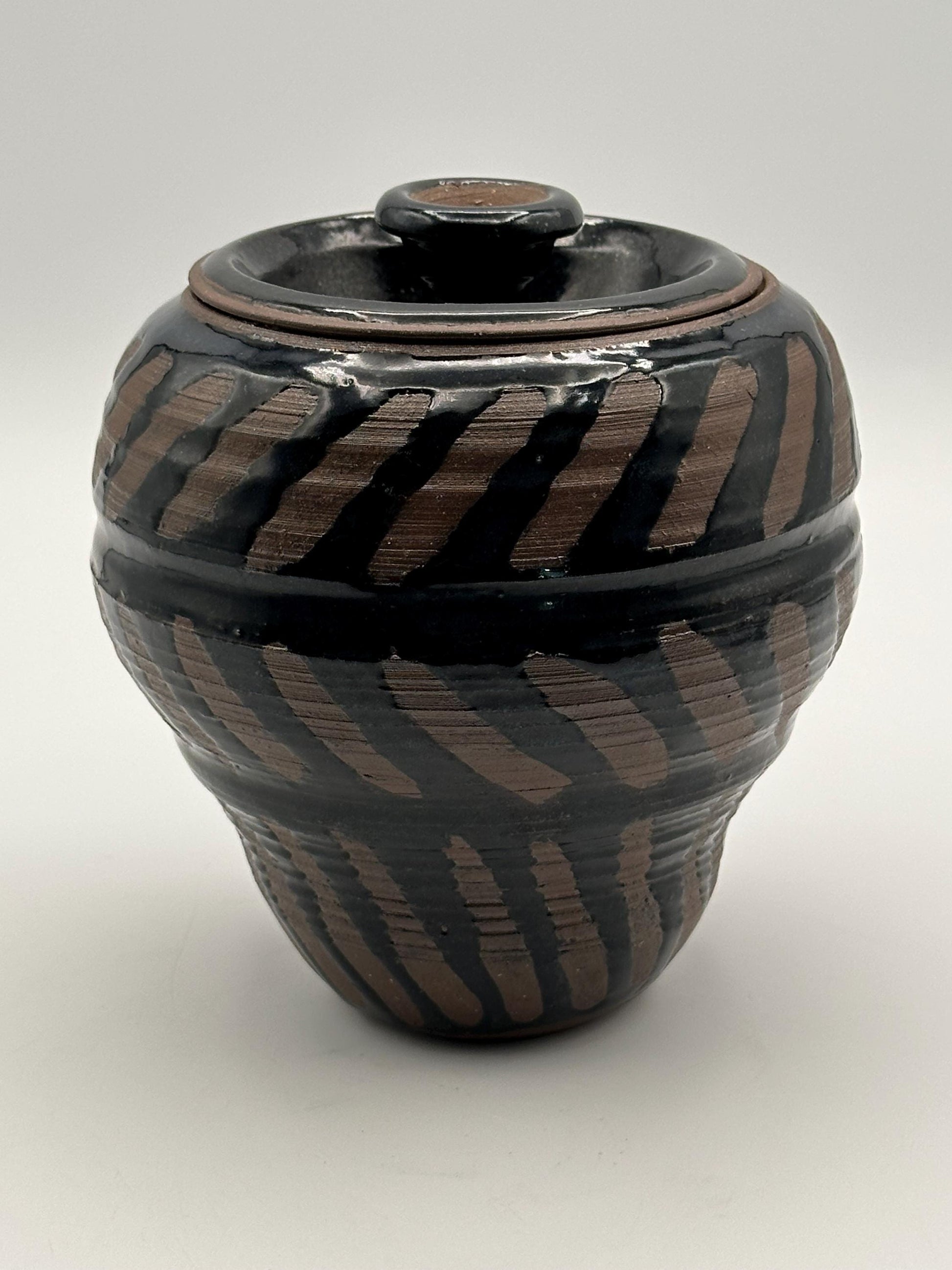 Artisan-Signed Rustic Stoneware Jar: Brown & Black Striped Pottery Vessel with Lid