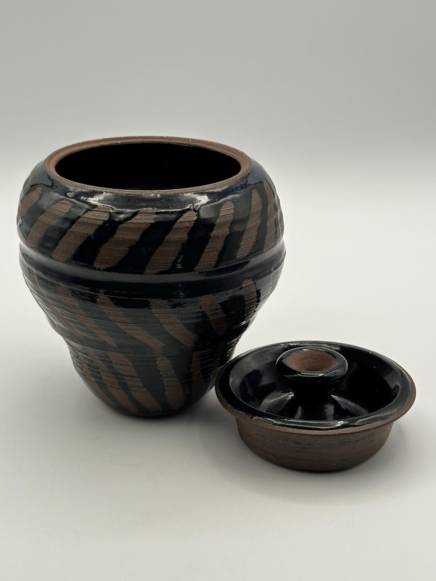 Artisan-Signed Rustic Stoneware Jar: Brown & Black Striped Pottery Vessel with Lid