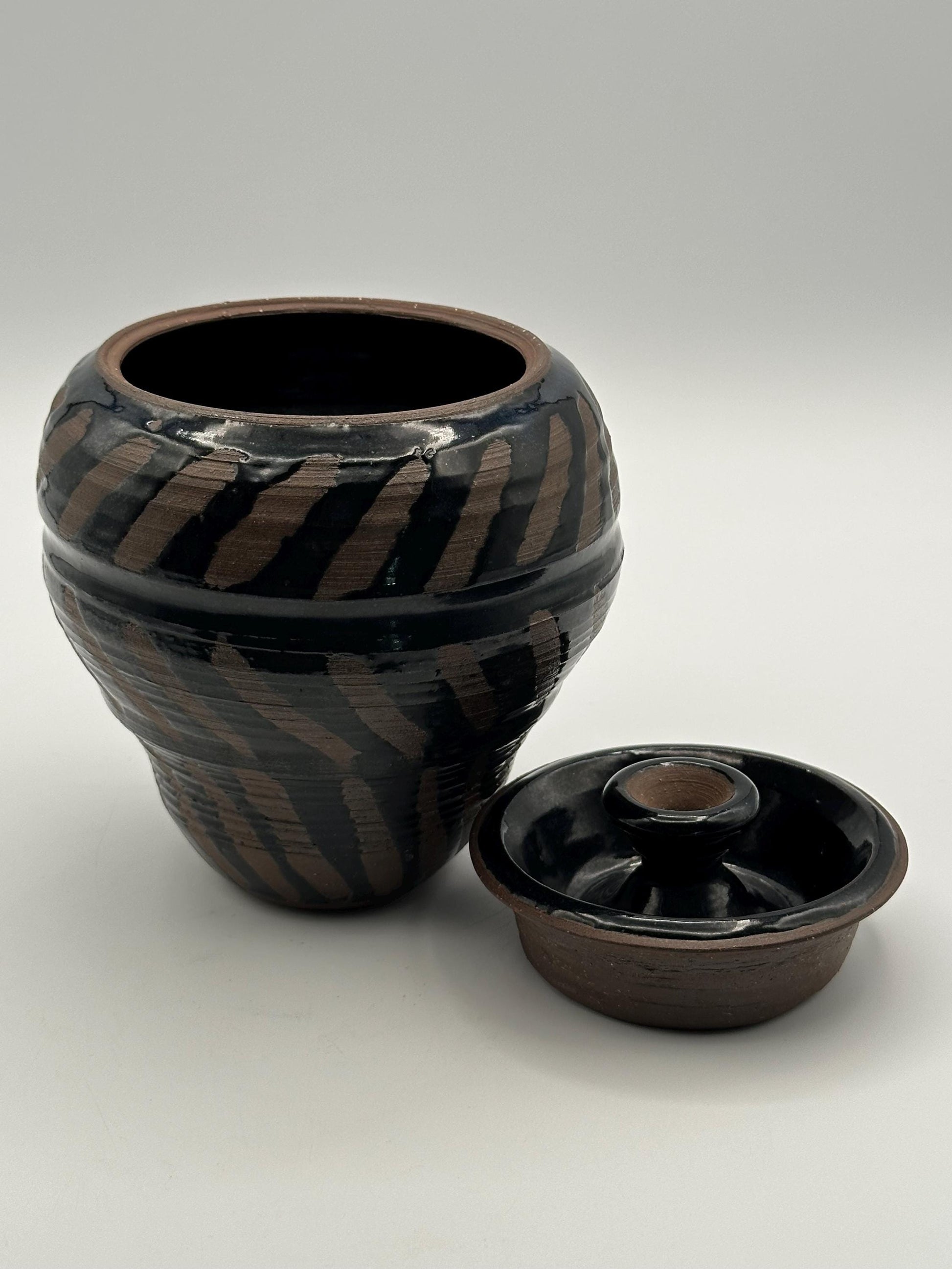 Artisan-Signed Rustic Stoneware Jar: Brown & Black Striped Pottery Vessel with Lid