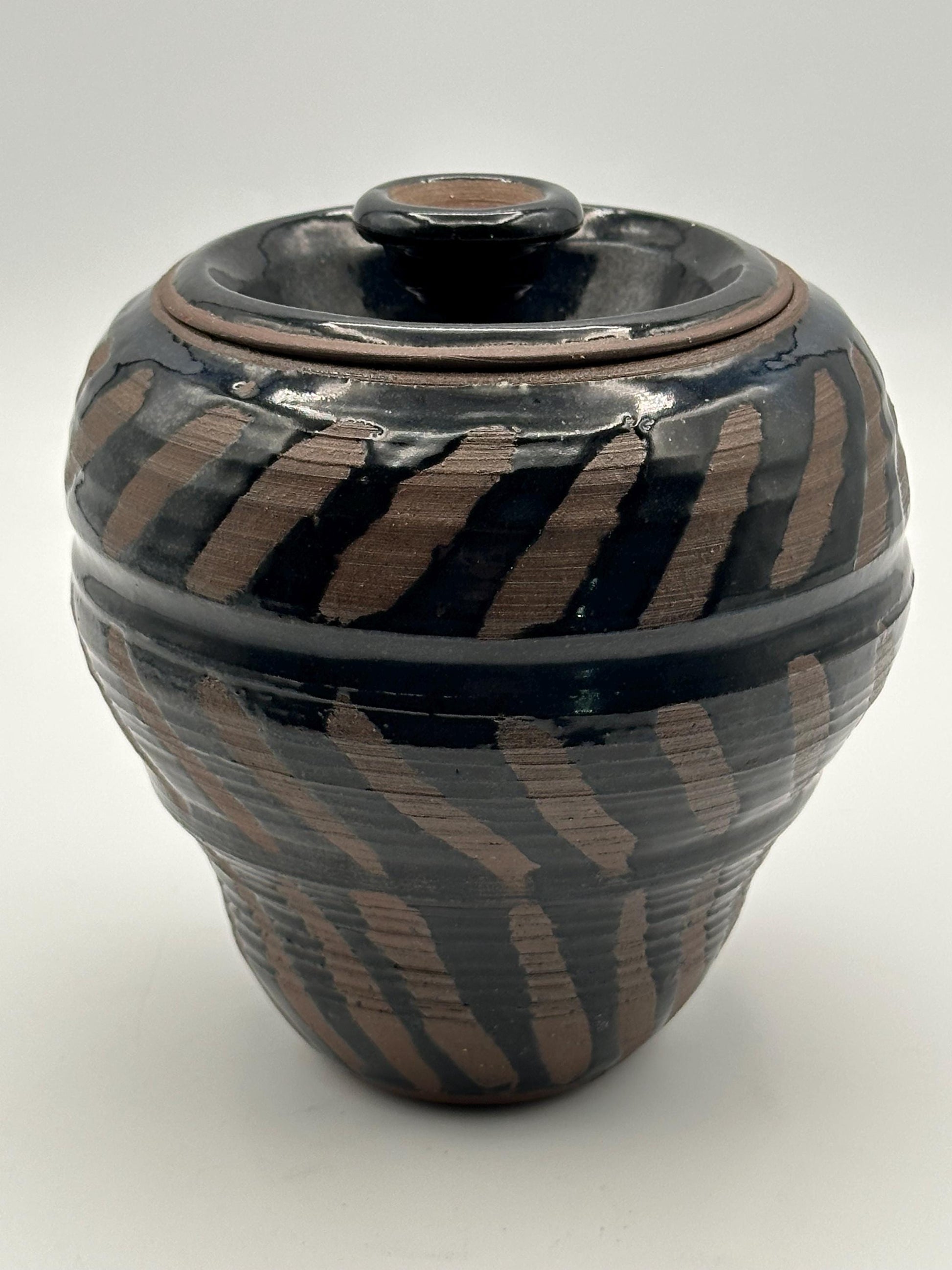 Artisan-Signed Rustic Stoneware Jar: Brown & Black Striped Pottery Vessel with Lid