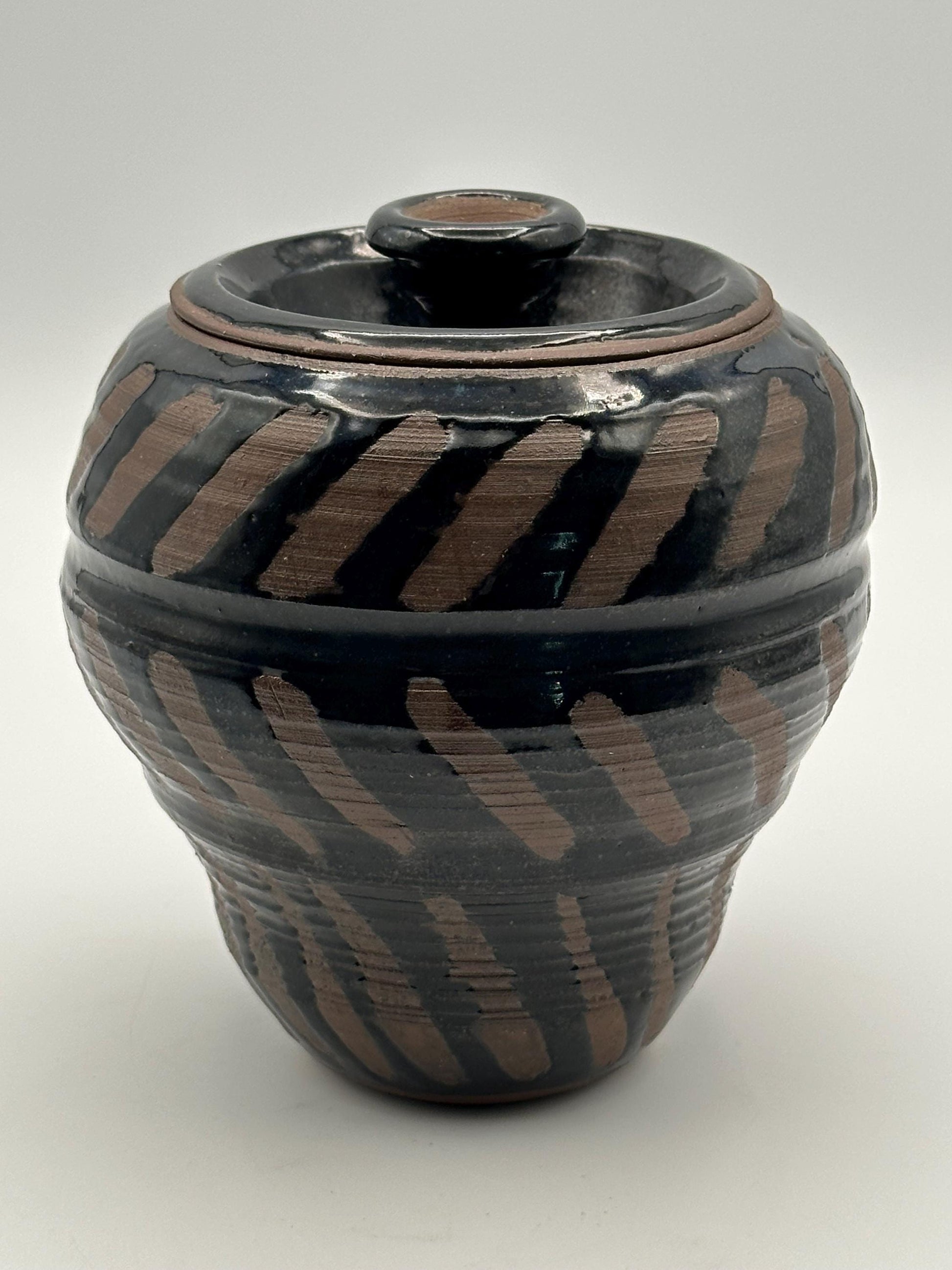 Artisan-Signed Rustic Stoneware Jar: Brown & Black Striped Pottery Vessel with Lid